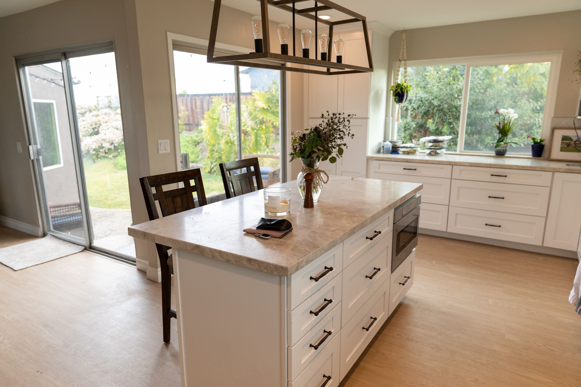 There is a large island in the middle of the kitchen.