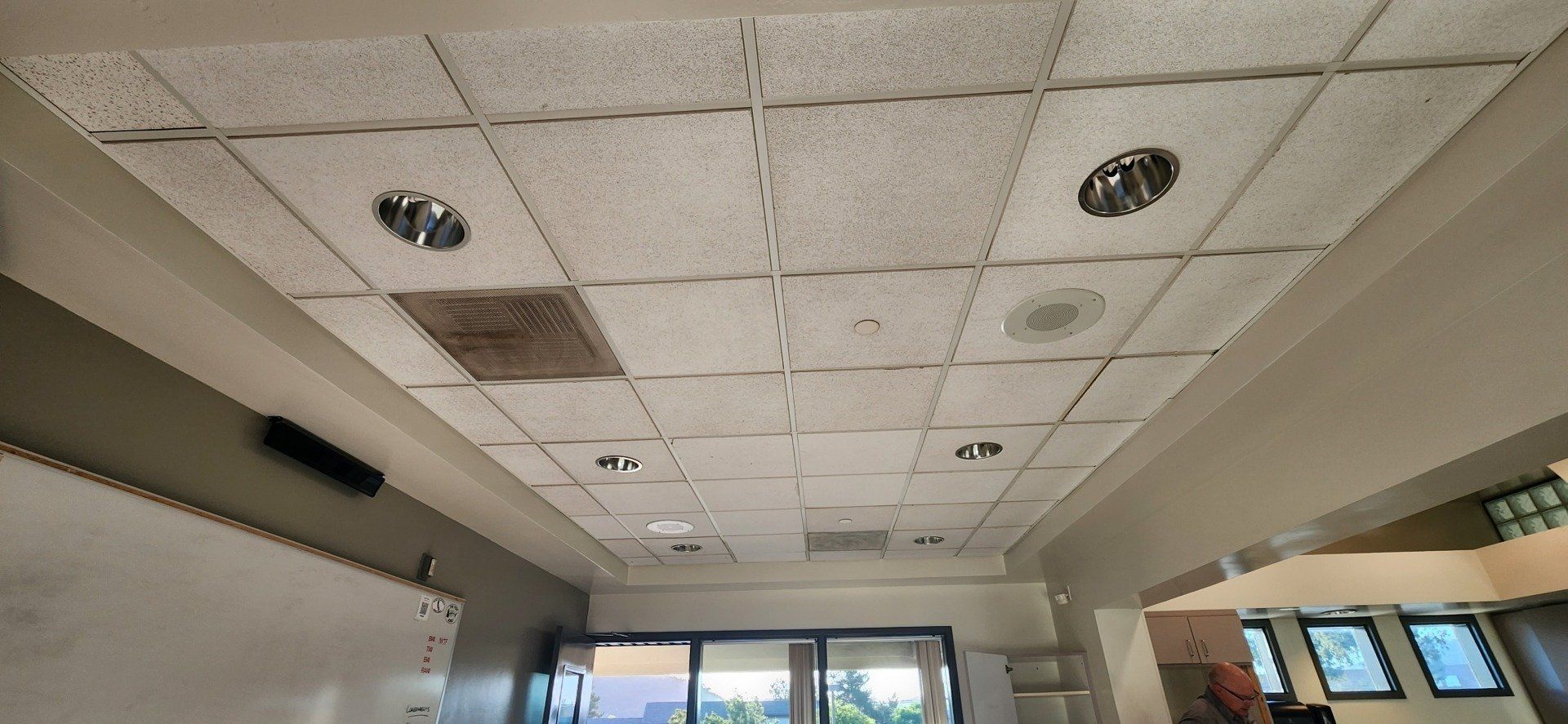 A room with a ceiling that has a hole in it