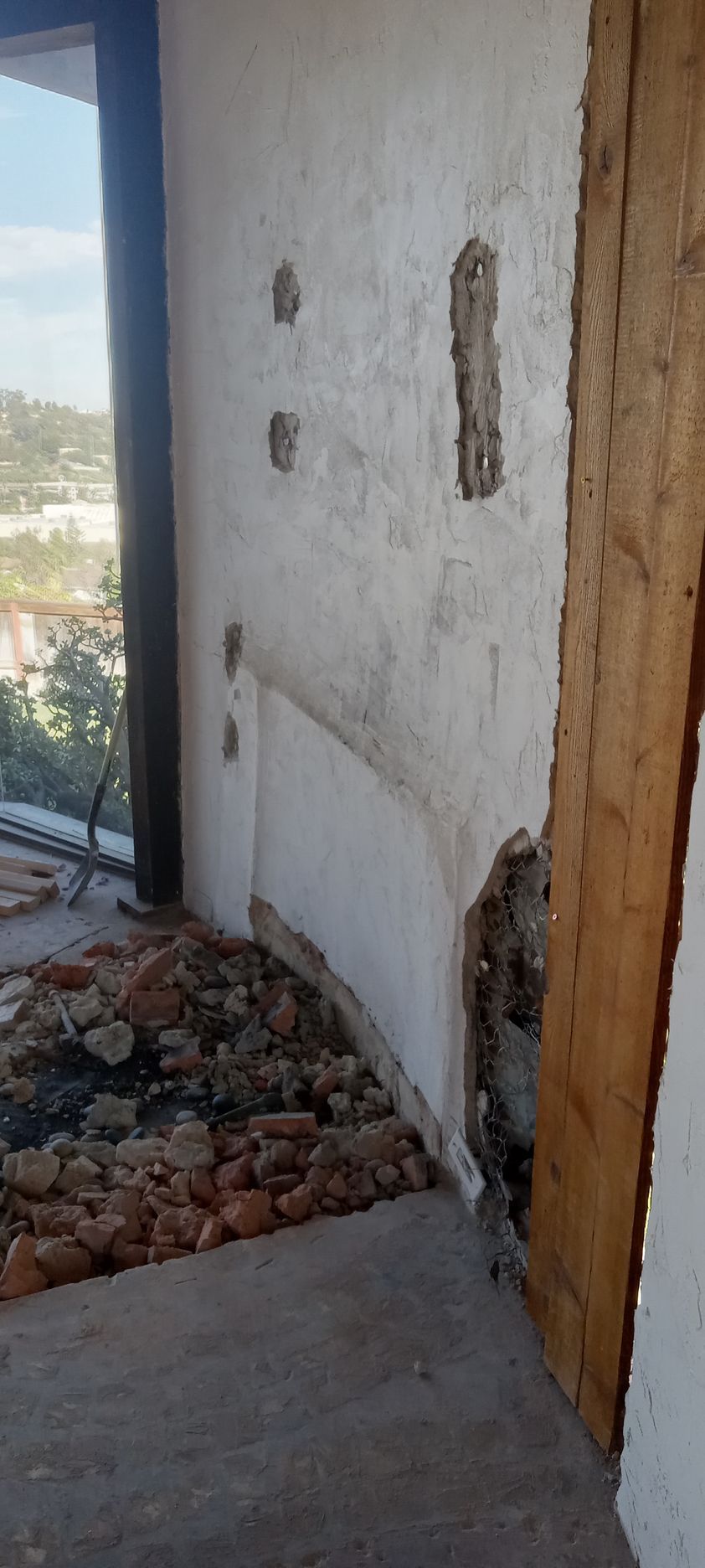 There is a hole in the wall in the middle of the room.