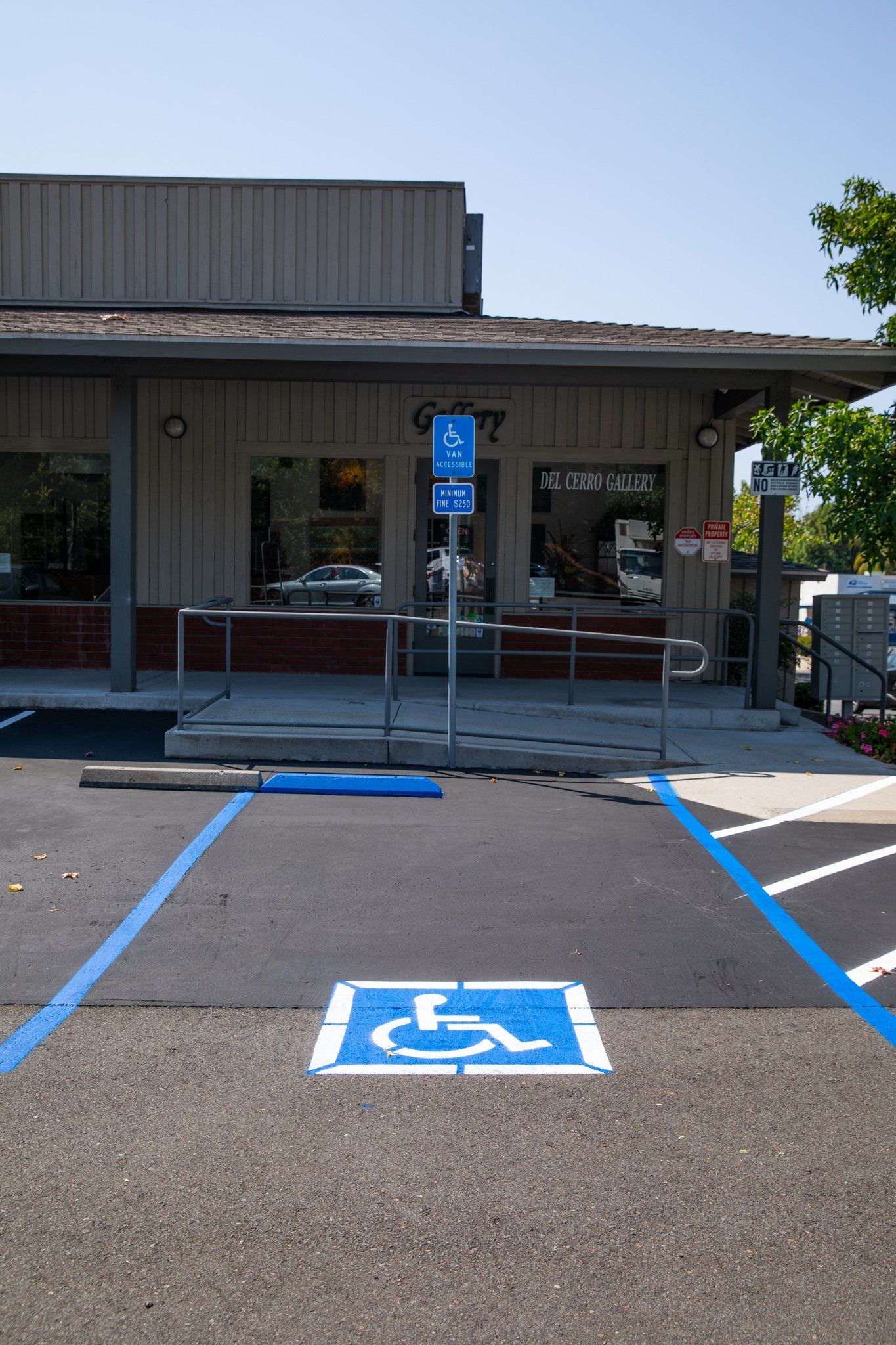 A handicapped parking spot in front of a building
