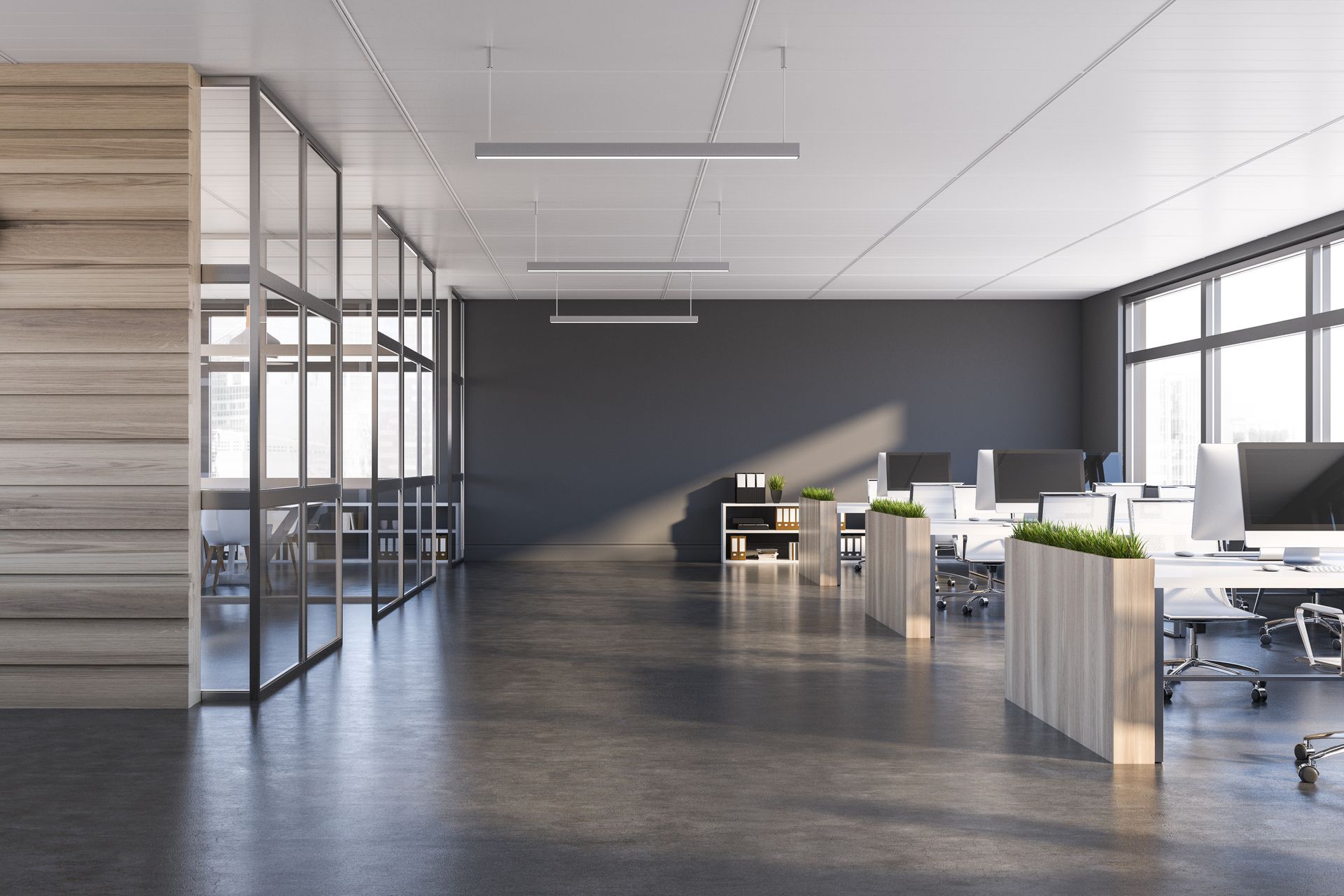An empty office with a lot of windows and desks.