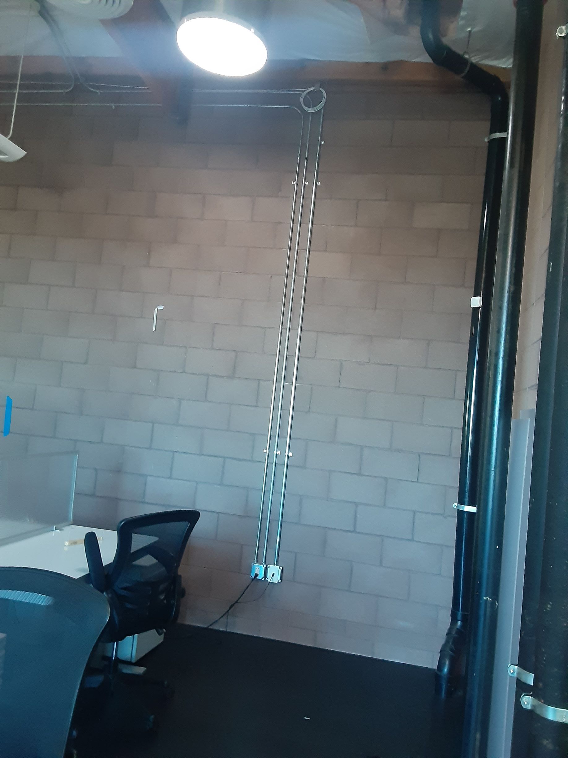 A chain is hanging from the ceiling in a room