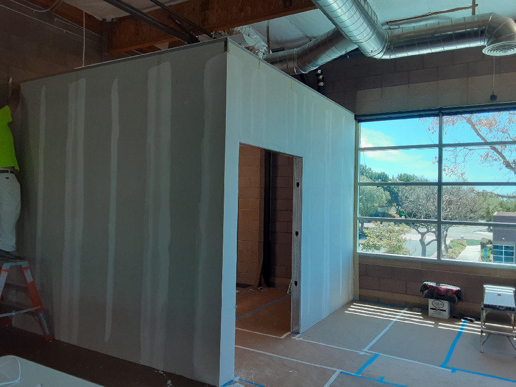 A room that is being remodeled with a large window