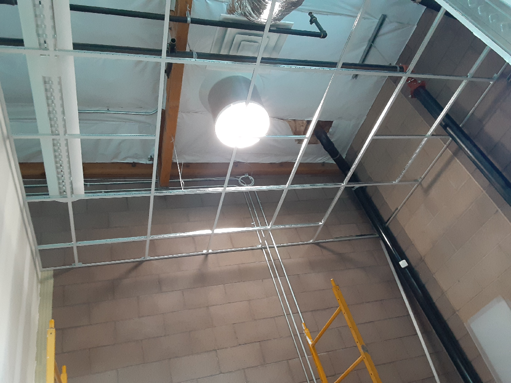 A ceiling with a light hanging from it