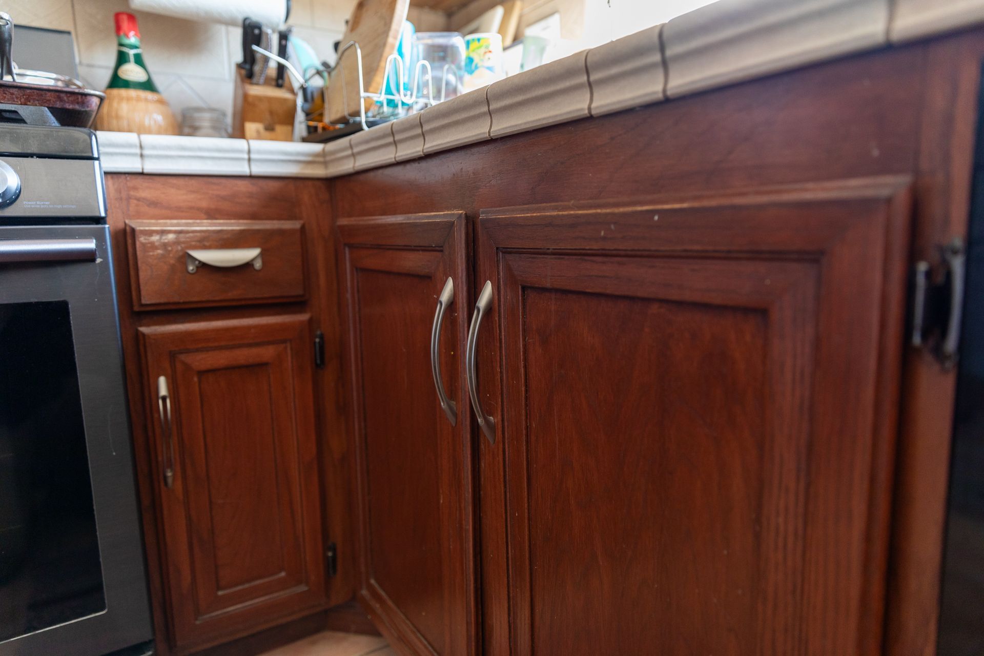 A kitchen with wooden cabinets and stainless steel appliances