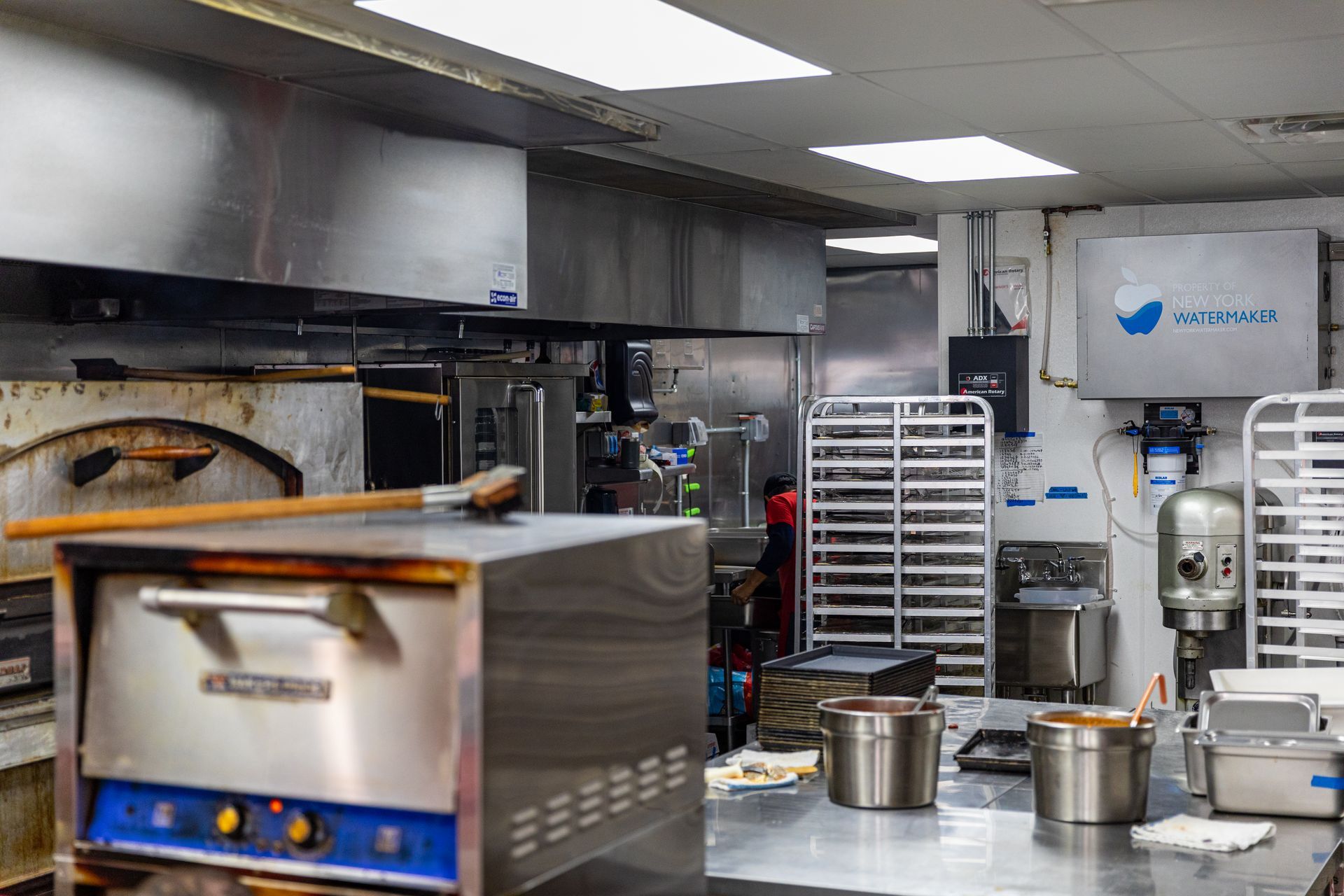 A kitchen with a pepsi sign on the wall