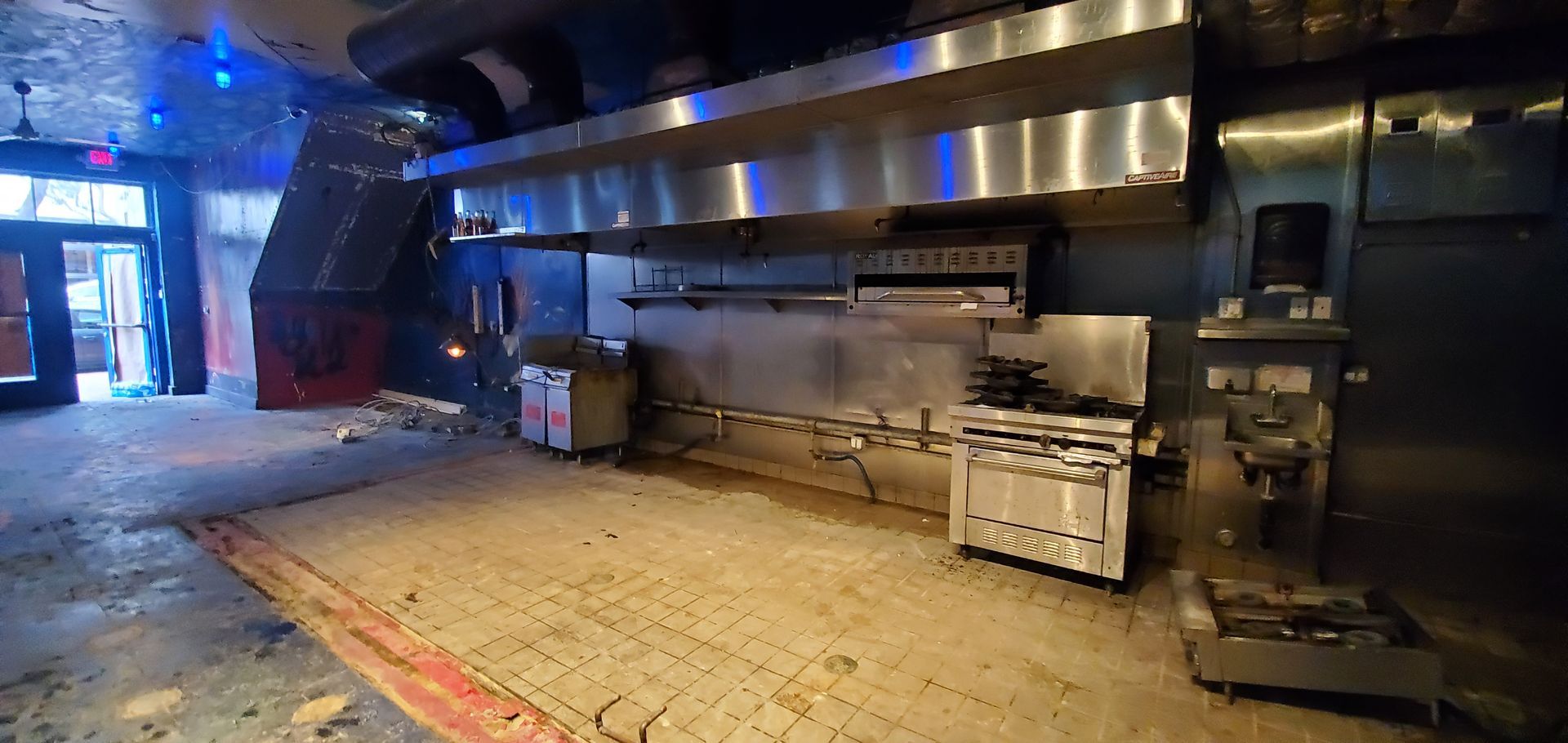 A kitchen with a stove that says ' stainless steel ' on it