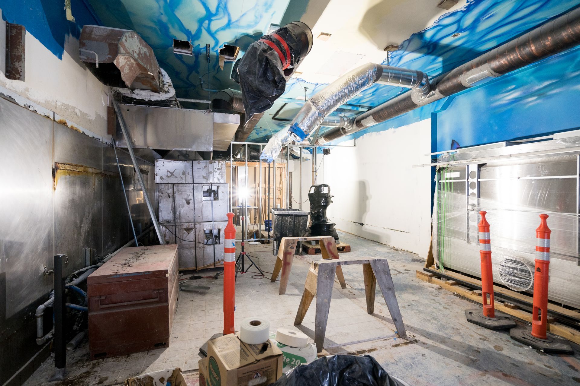 A room with a ceiling that has graffiti on it