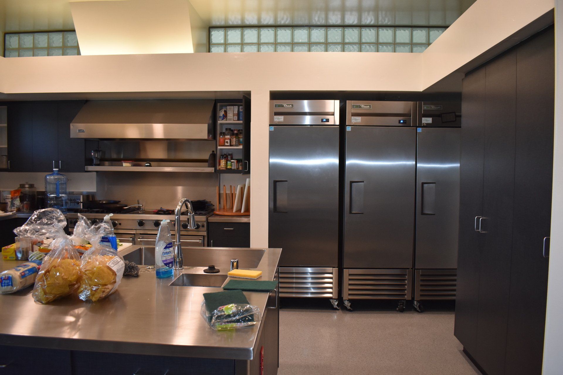 A kitchen with a lot of stainless steel appliances