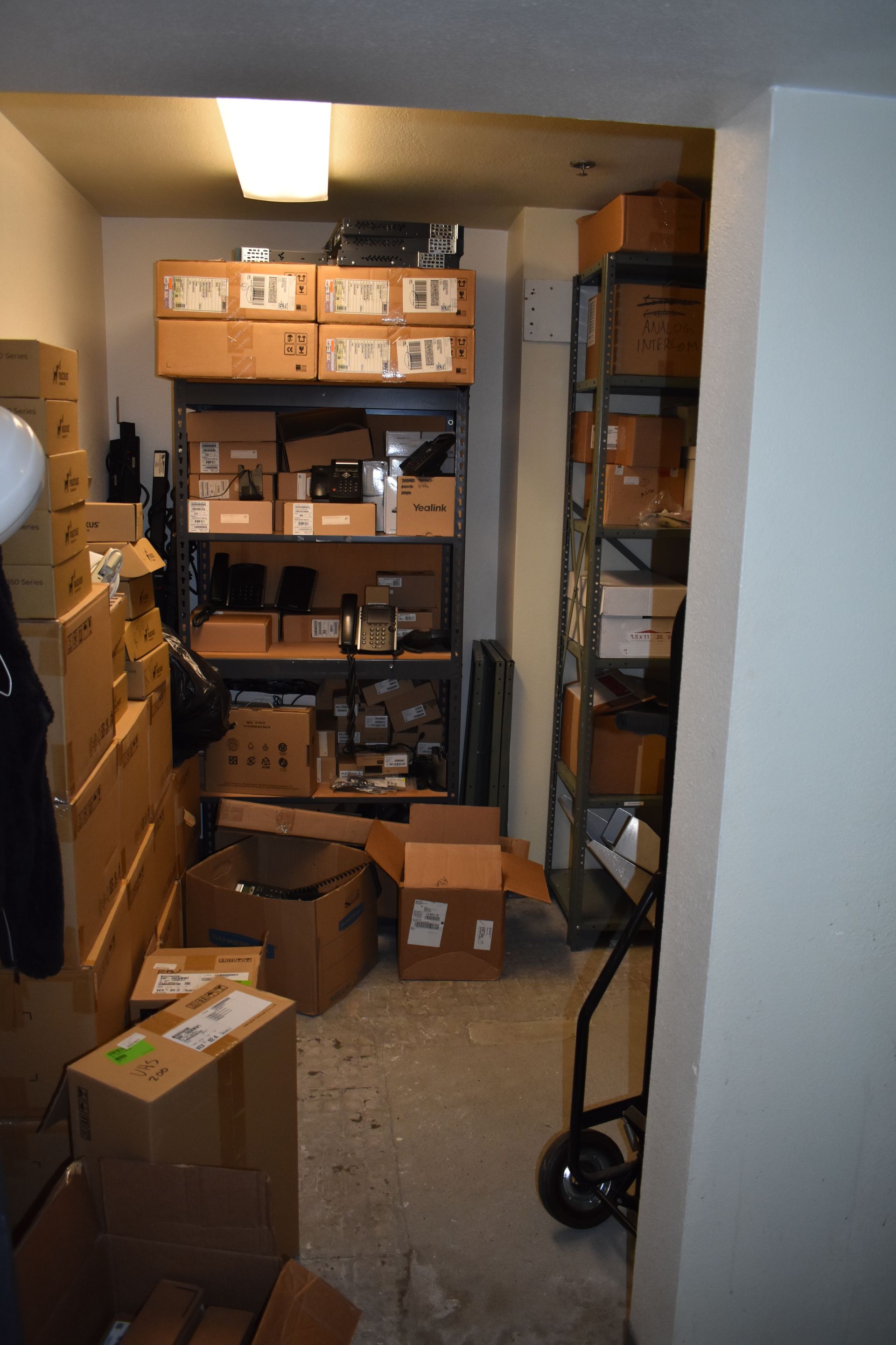 A room filled with lots of boxes and shelves.