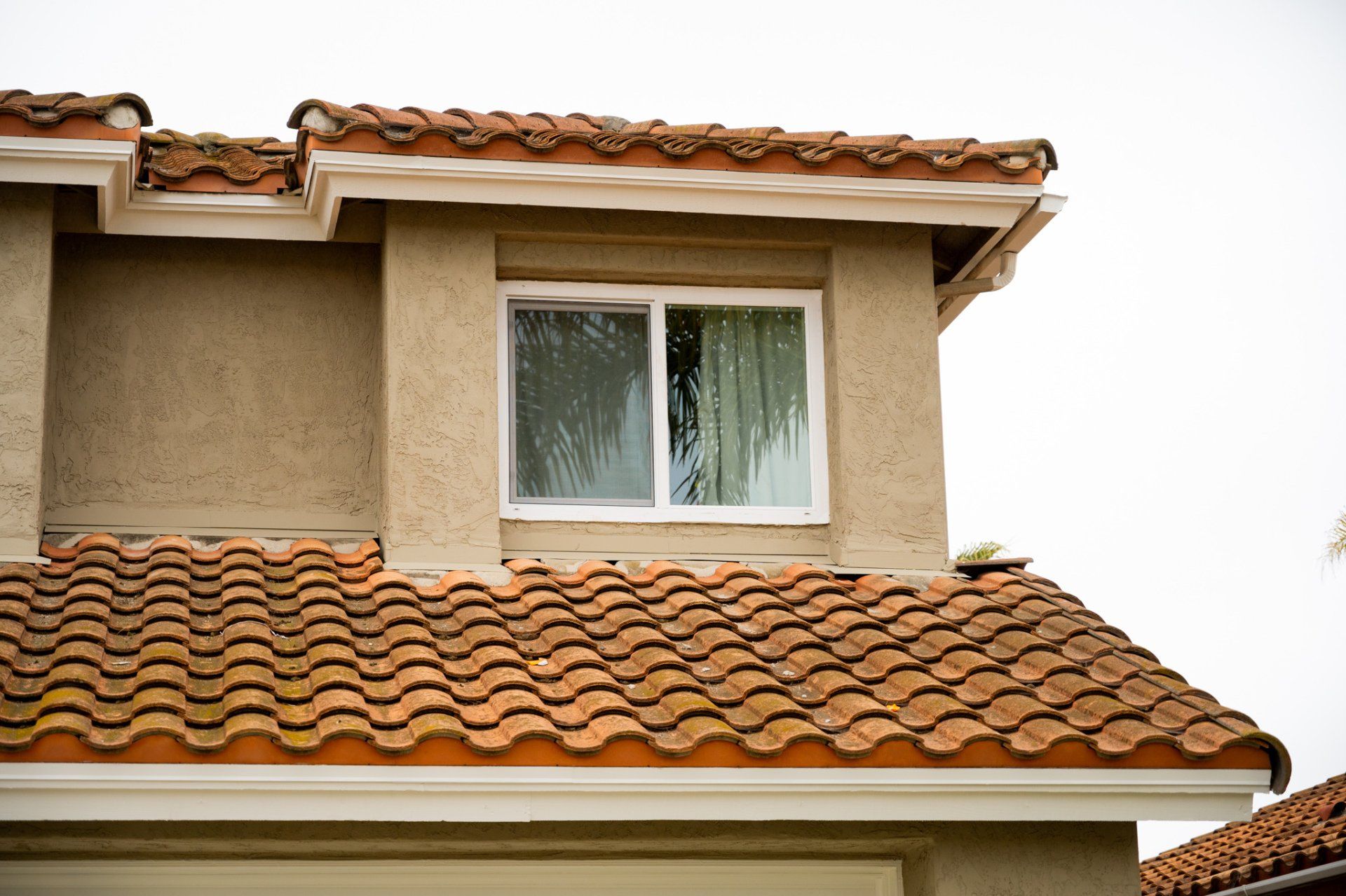 A house with a tiled roof and a window