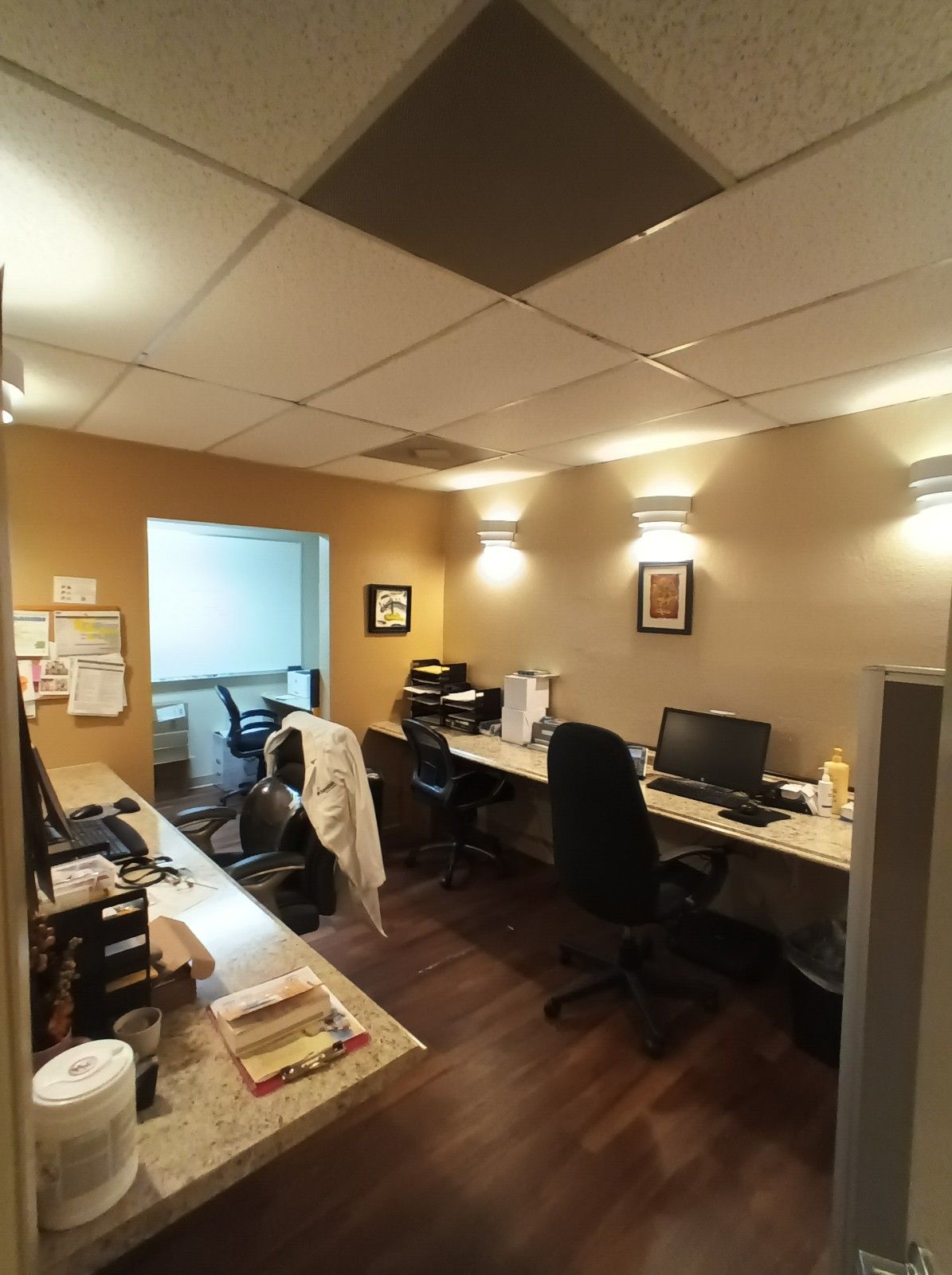 An office with a lot of desks and chairs