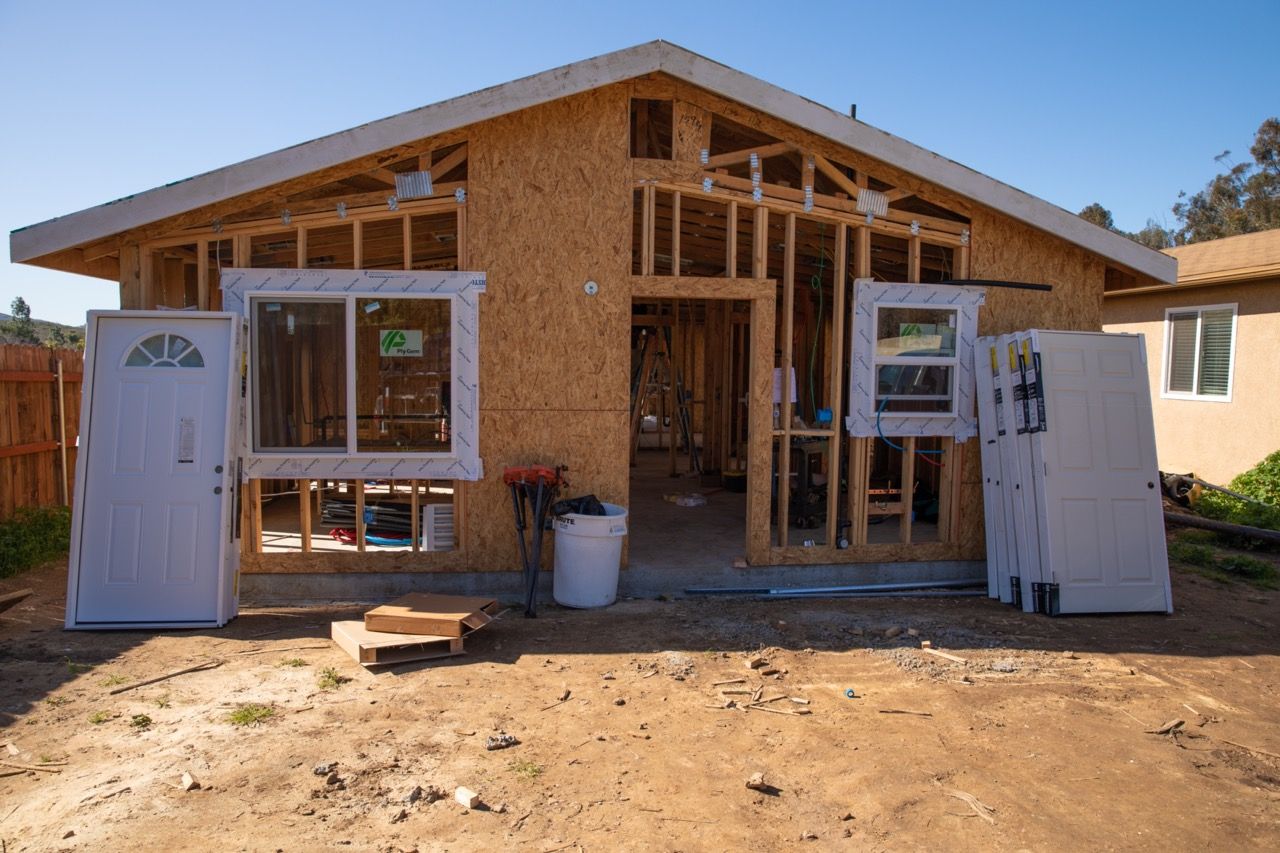 A house is being built with a lot of windows and doors