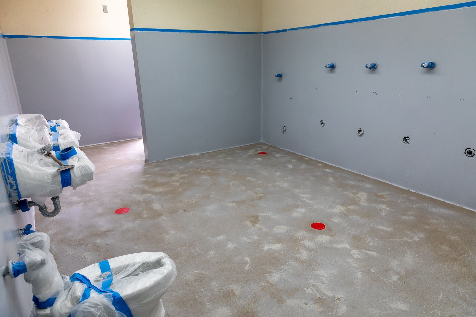 A bathroom with a toilet and a sink in it