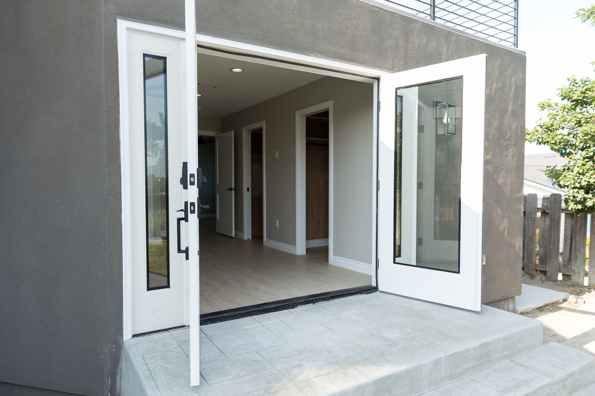 A house with a sliding glass door that is open