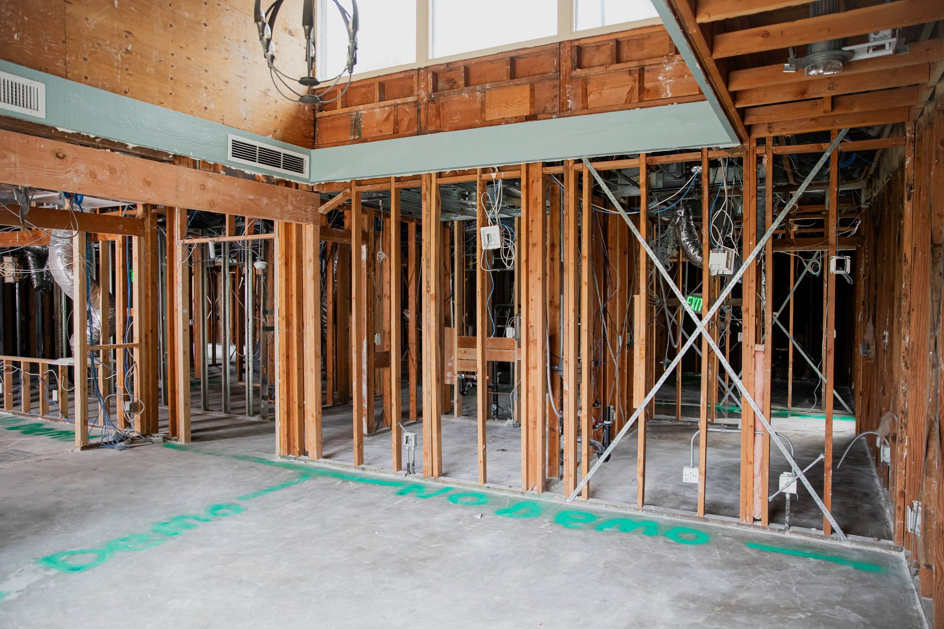The inside of a building under construction with wooden beams.