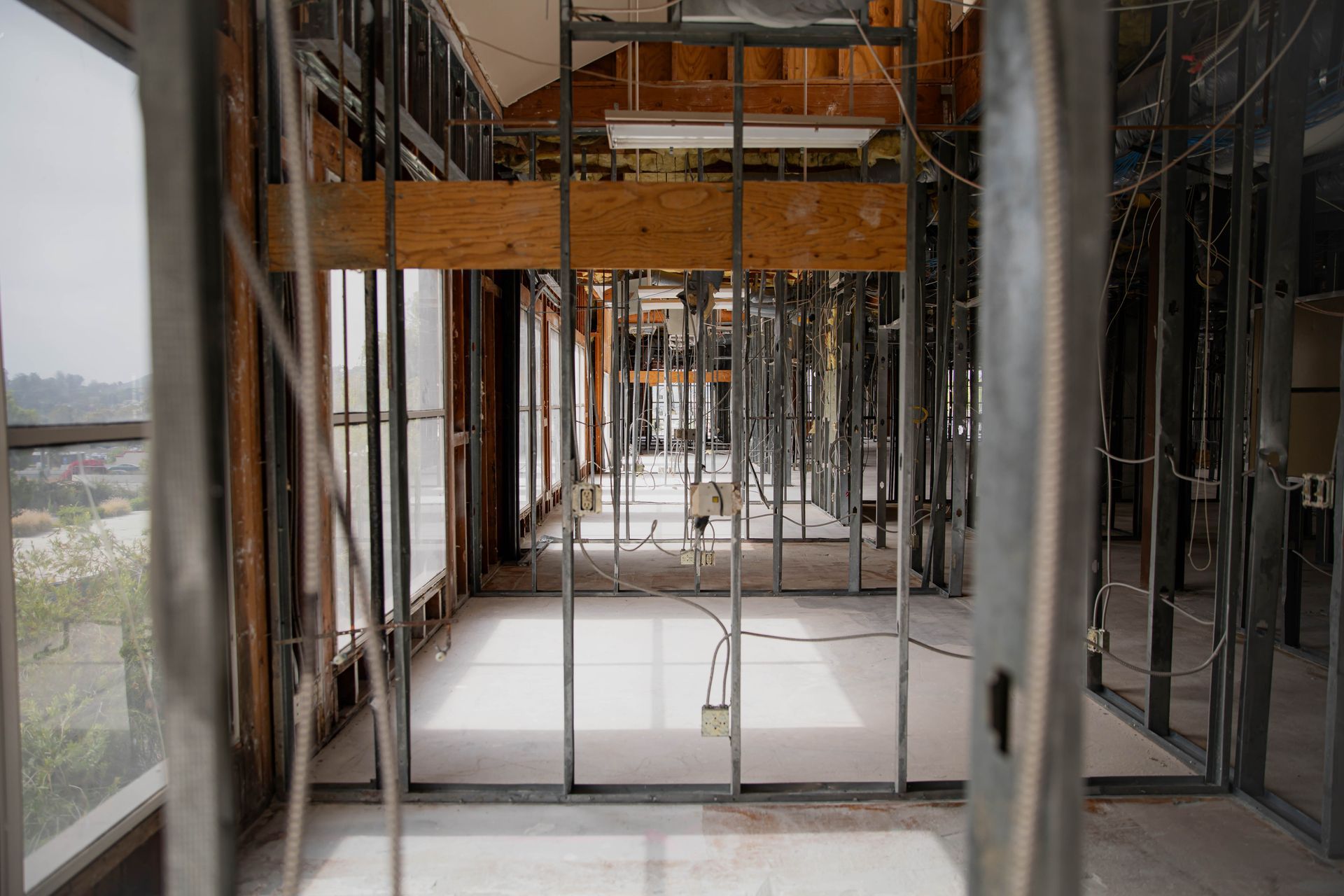 The inside of a building under construction with a lot of metal frames.