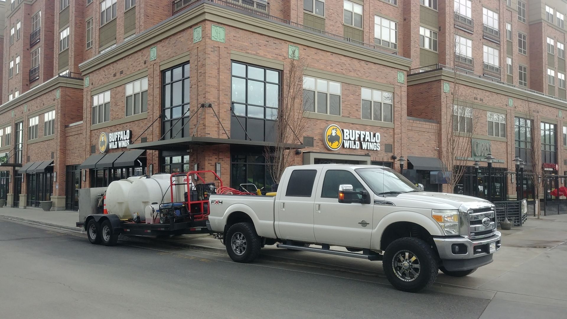 Professional pressure washing company vehicle set up for commercial pressure washing jobs