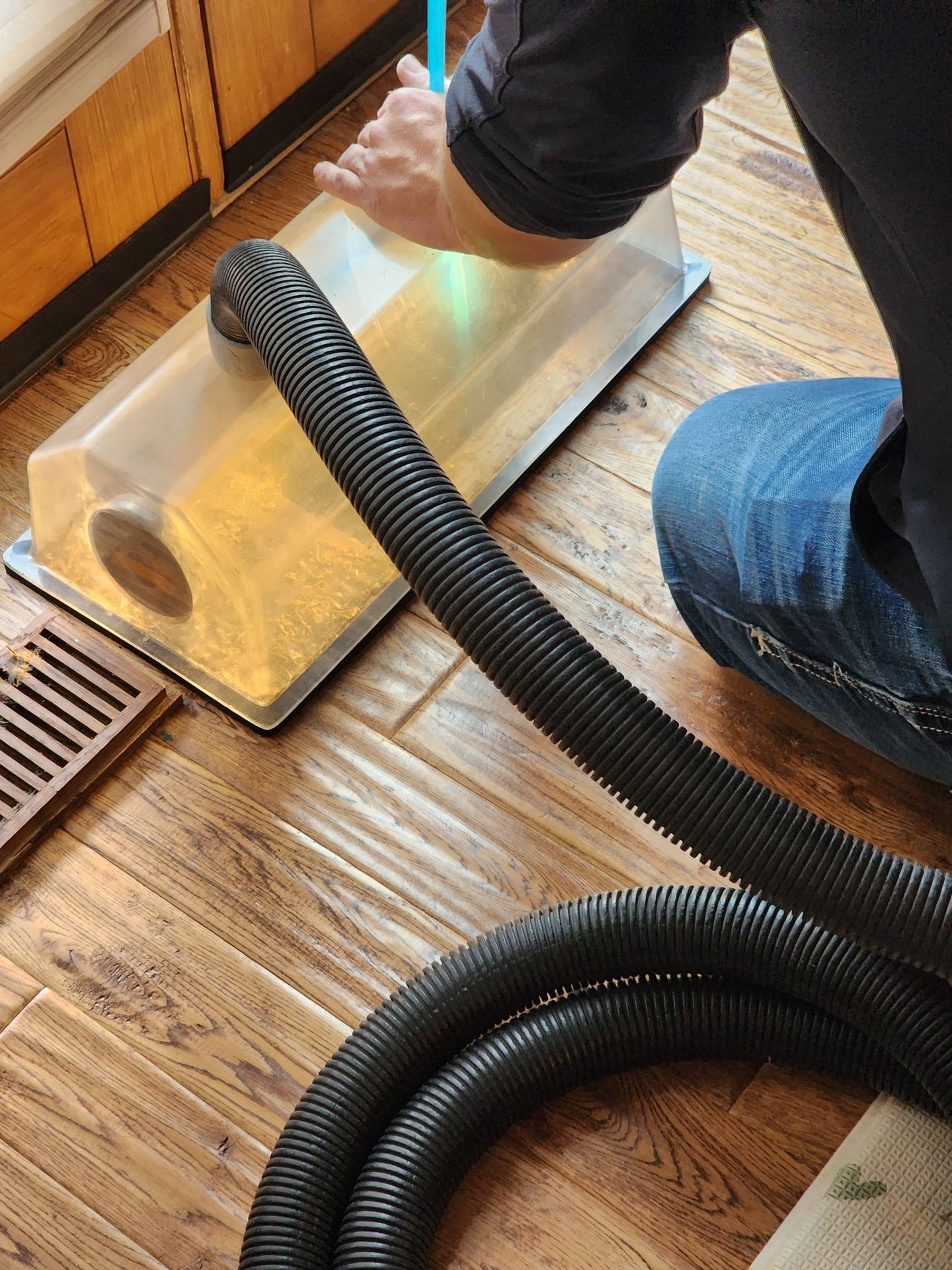 Air duct cleaning contractor using specialized tools for residential ductwork maintenance