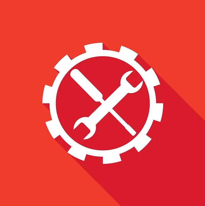 A wrench and screwdriver in a gear on a red background
