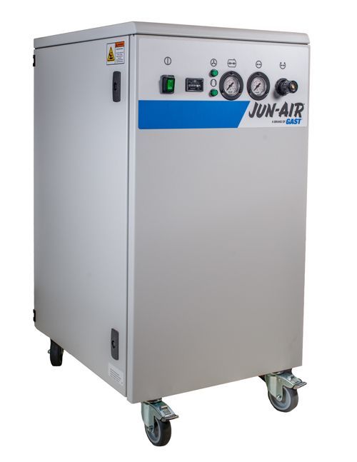 A JUN-AIR medical air compressor in a light grey cabinet with blue accents, mounted on wheels.