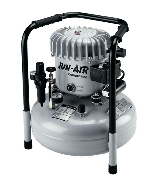 A grey JUN-AIR air compressor with a black frame, gauges, and a handle.