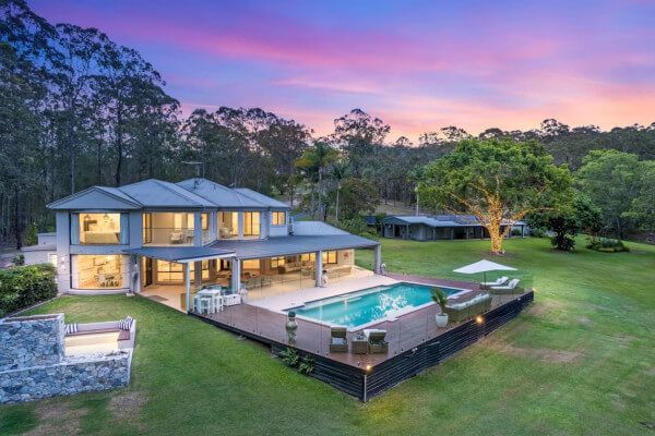 Luxurious hinterland retreat with pool and lush views — secluded family holiday home near Byron Bay.