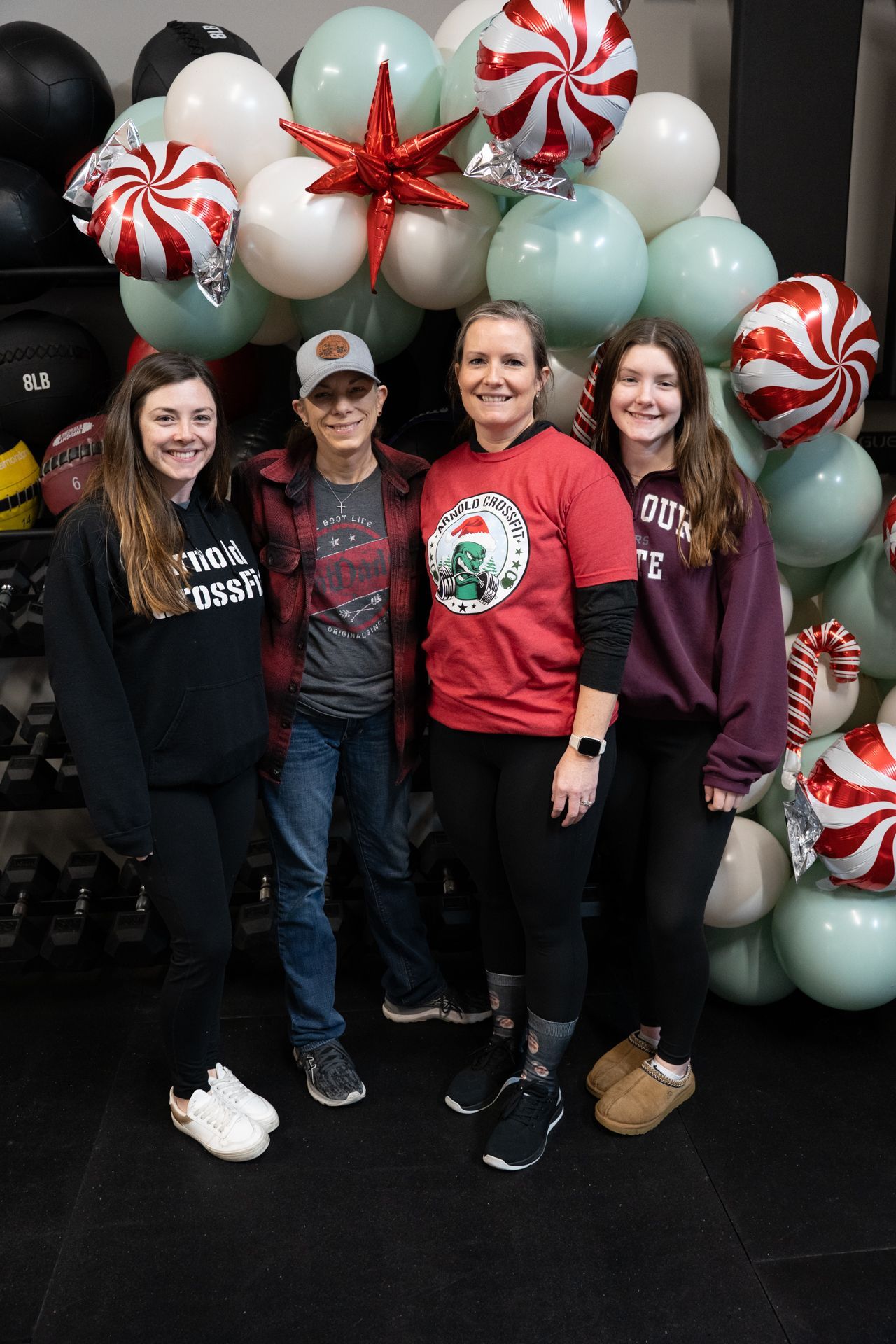 Smiling CrossFit athletes in festive attire at our Christmas morning brunch. 