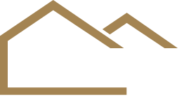 Icône représentant une maison stylisée brune et des sommets montagneux.