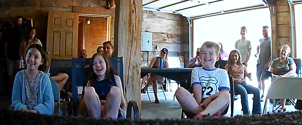 Engaged parents and children watching the show