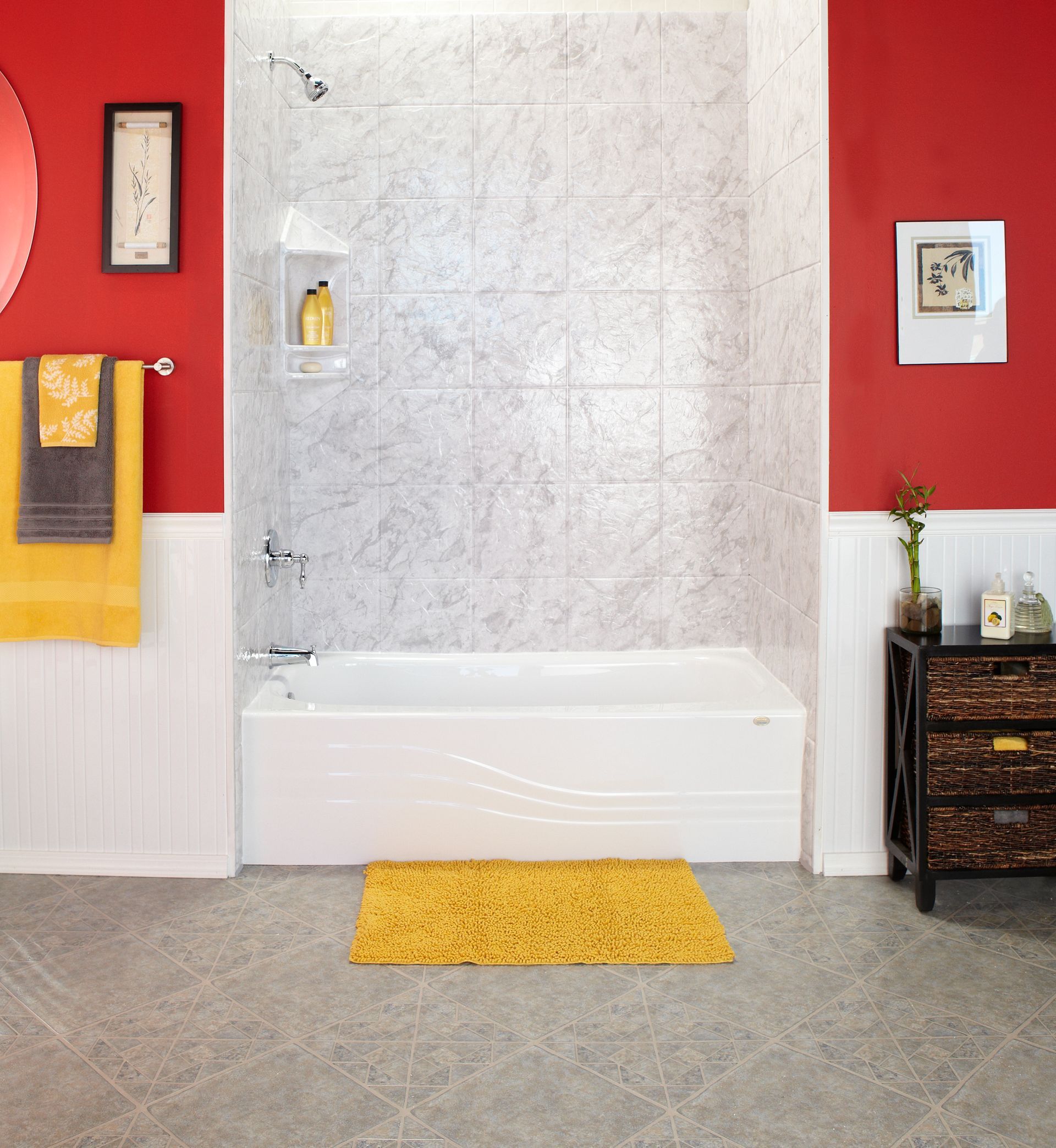 Bathroom with dark wood vanity, beige tub-shower, pink walls, and framed wall decor