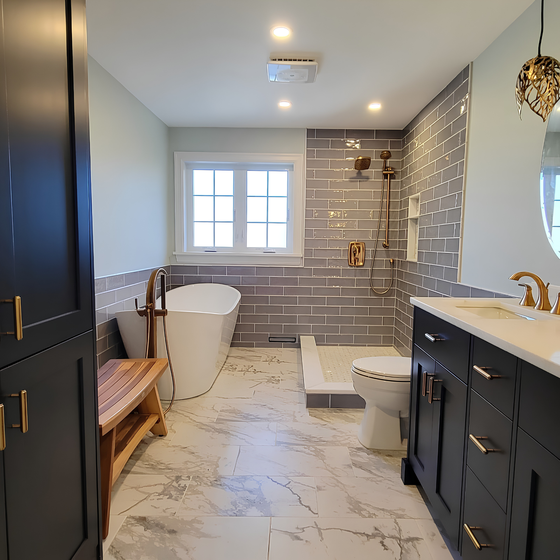 Modern bathroom with walk-in shower, freestanding tub, double vanity, and gray brick tile walls