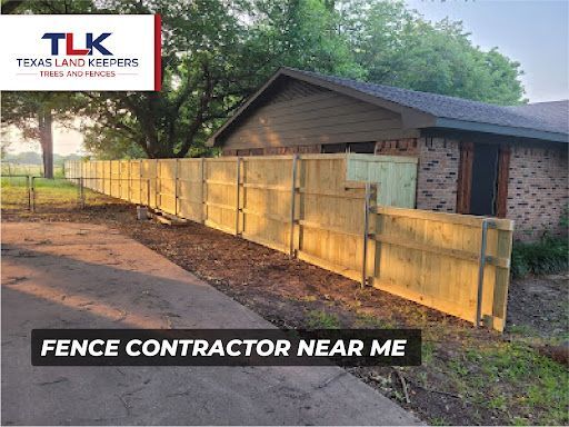 New wooden privacy fence beside a house with TLK Texas Land Keepers logo and “Fence contractor near me” text