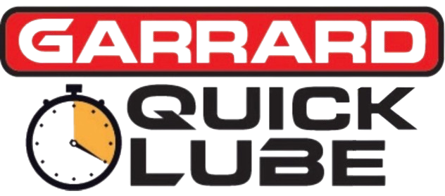 The logo for garrard quick lube has a clock on it