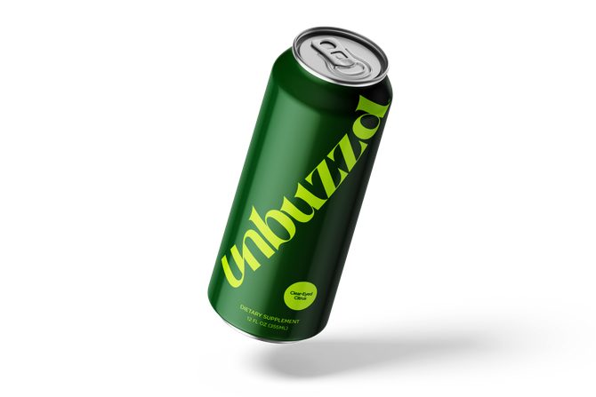 A green can of unbuzzd soda is floating in the air.