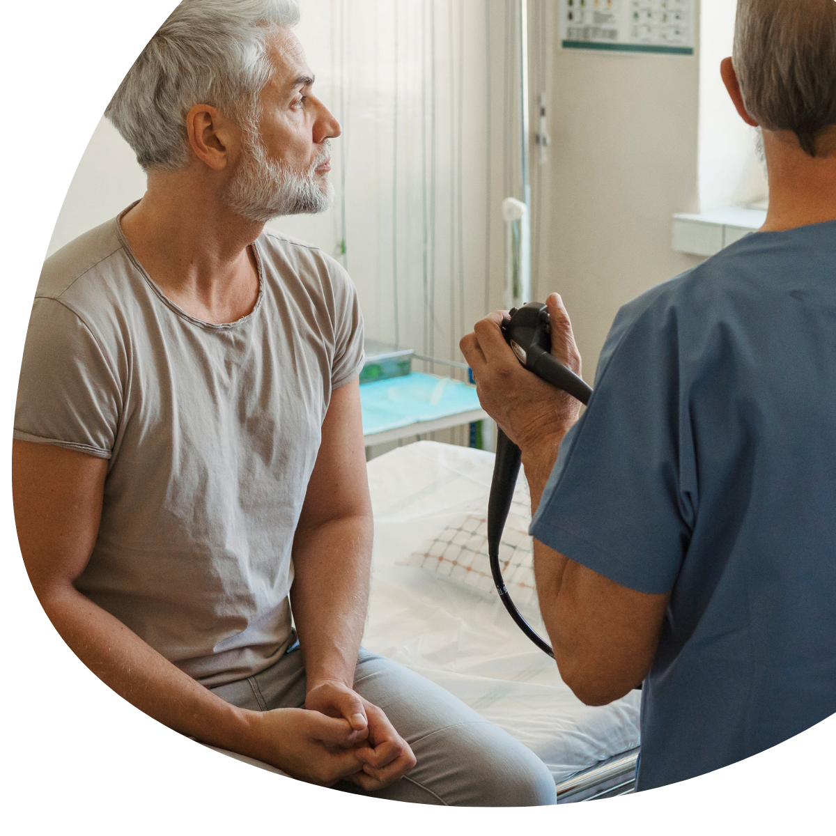 Doctor taking a patient's blood pressure in a clinic room