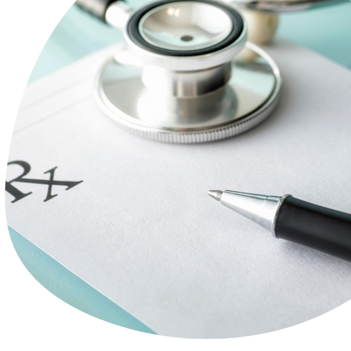 Stethoscope and pen on prescription paper, suggesting medical prescribing or healthcare documentation