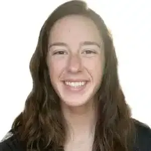 Smiling person with long brown hair against a plain white background
