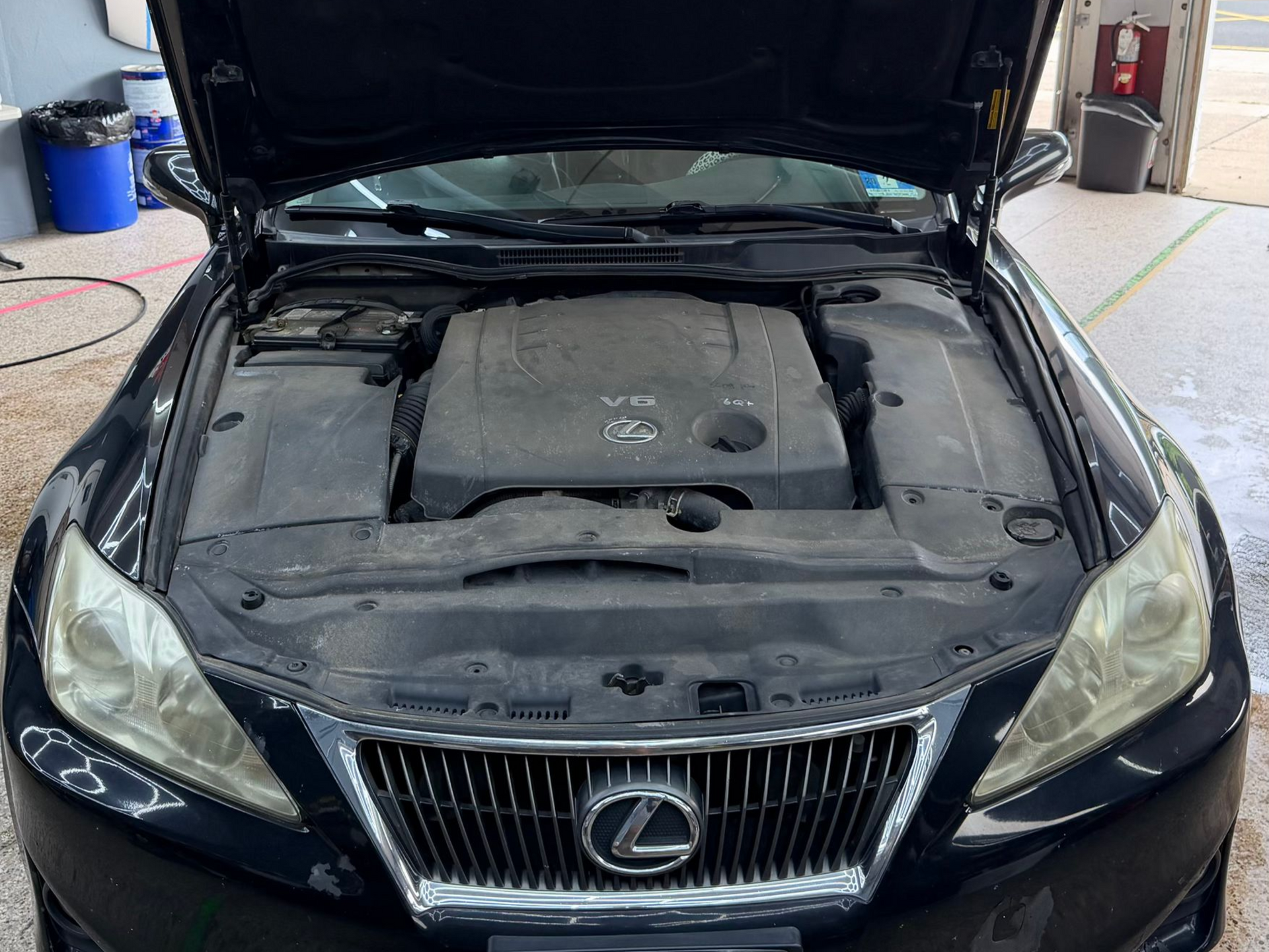 Lexus engine bay before professional detailing