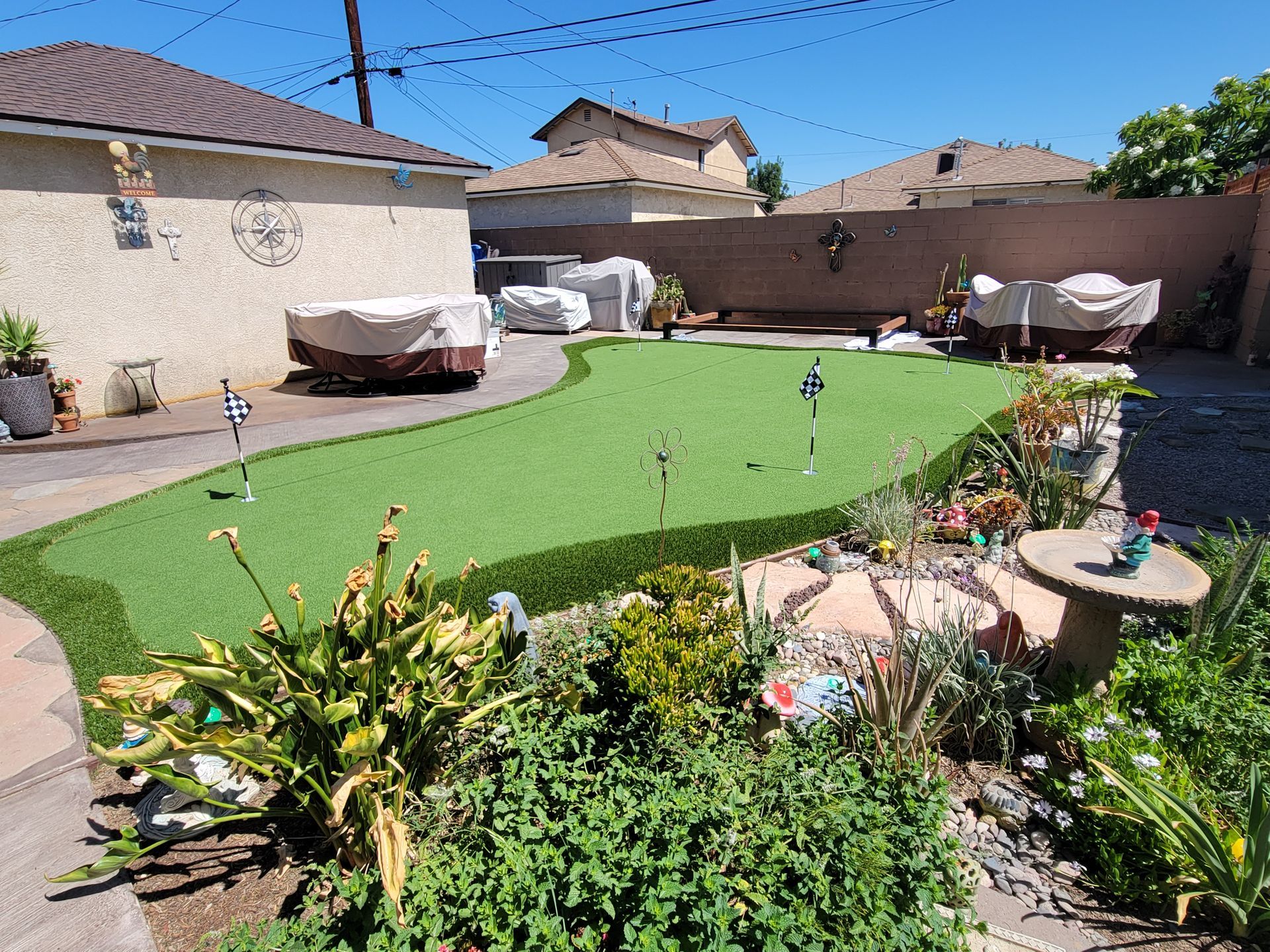 flowers surrounding putting green
