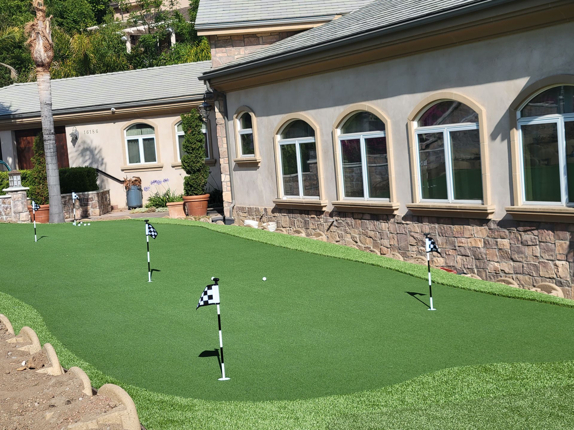 synthetic putting green with checkered flags