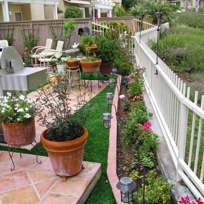 strip of artificial grass next to planter