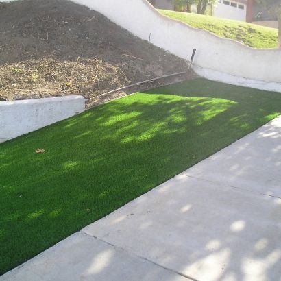 synthetic grass next to sidewalk