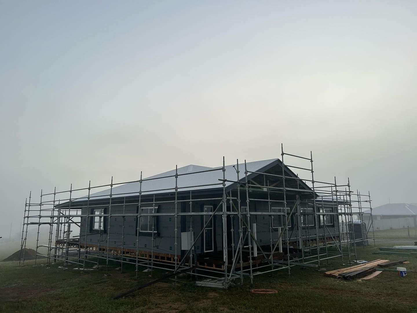 House Under Construction With Scaffolding Around It — Builder In Gympie, QLD