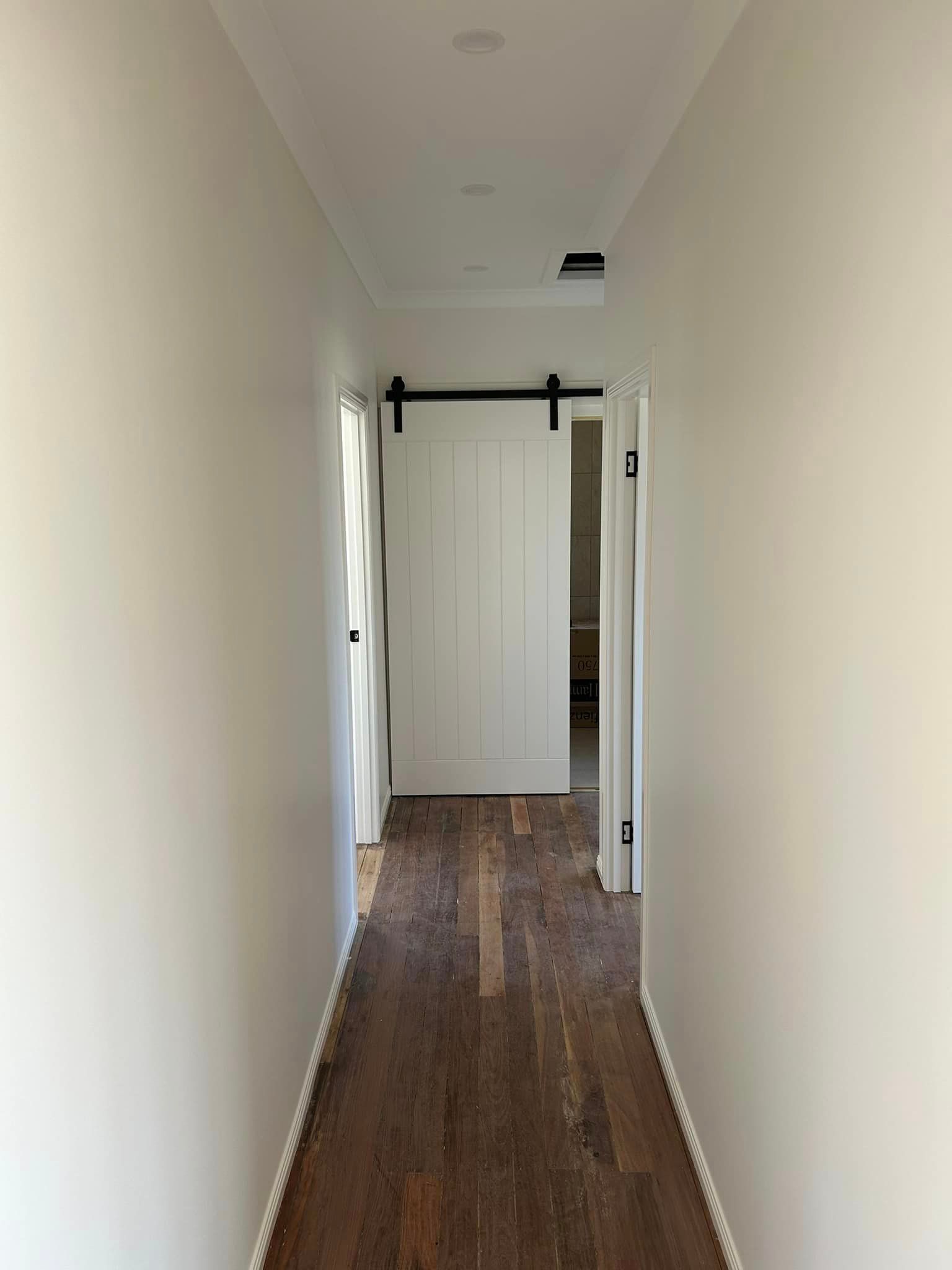 Hallway Features a Classic Queensland Sliding Barn Door — Builder In Gympie, QLD
