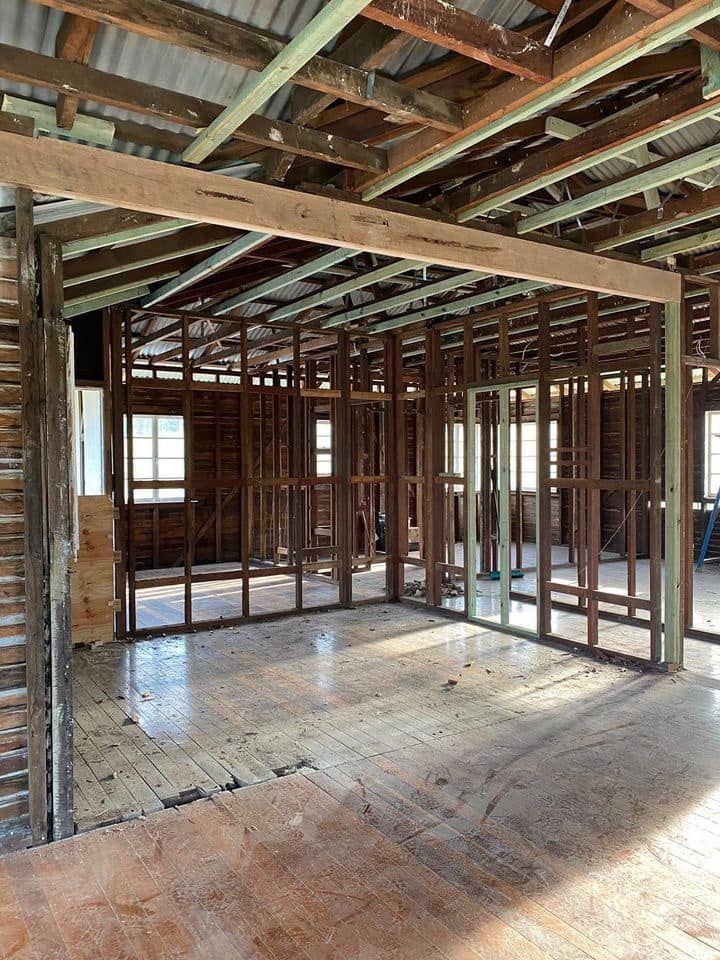 Inside Of A House Under Construction With Wooden Beams — Builder In Gympie, QLD