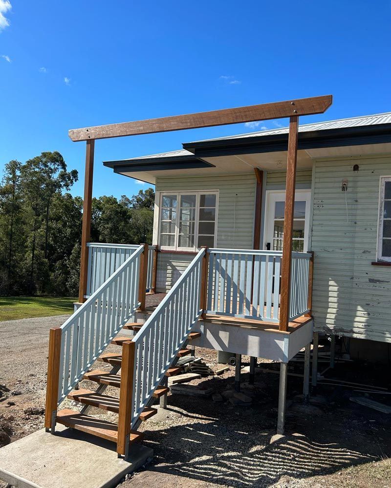 Classic Queensland Homes Presents a Charming White Residence With Inviting Stairs — Builder In Sunshine Coast, QLD