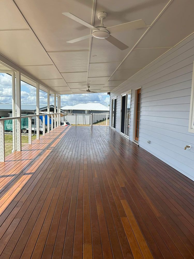 Spacious Wooden Deck Featuring a Ceiling fan Classic Queensland Homes — Builder In Sunshine Coast, QLD