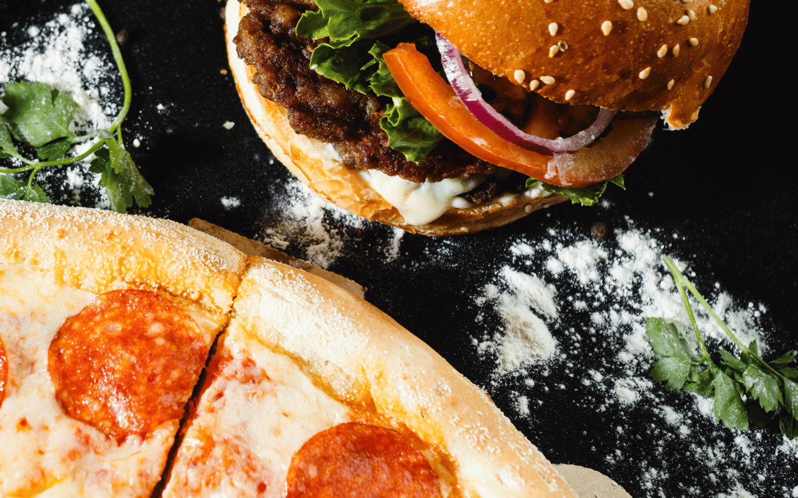 a pizza next to a burger