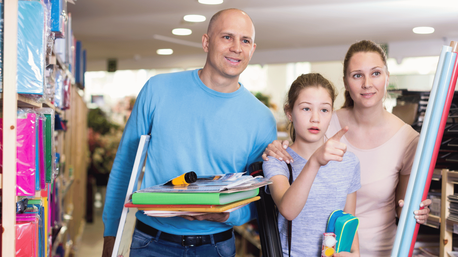 Parents and their child choosing school supplies, illustrating a family preparing to make its final school decision.